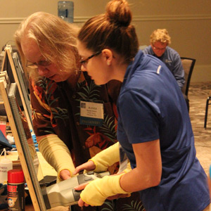 two people at a station during workshop