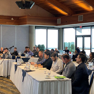 Attendees at a Member Edge FENBC regional event networking and discussing.