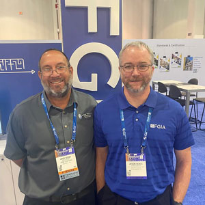 Andy Cost from ABB Testing and Jason Seals from FGIA in the show booth at GlassBuild America