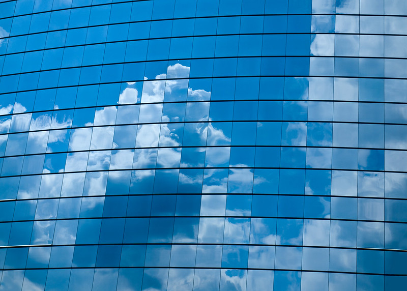 cloud reflection in glass panels on a building
