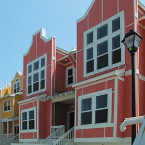 pink and yellow townhome exterior