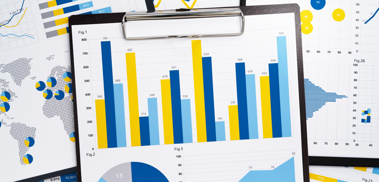 various graphic charts of data with a clipboard