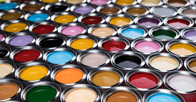 various colors of open paint cans in several rows