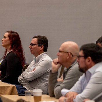 FGIA members in a meeting at a conference