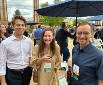 members at a conference reception outside