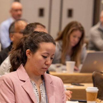 members at a conference in a meeting session