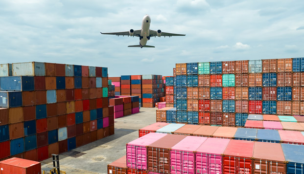 supply chain airplane flying above containers