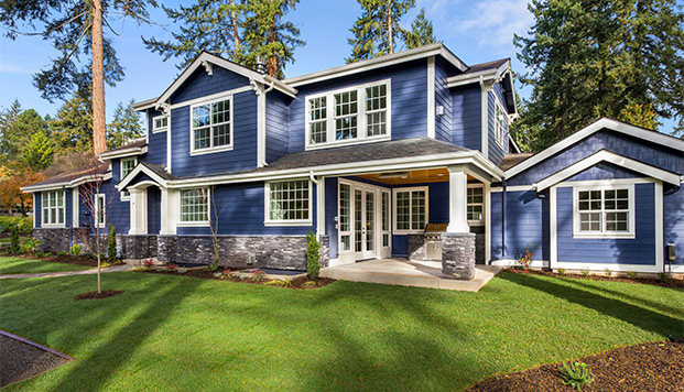 NAFS-26 residential Beautiful blue home exterior with white trim and large windows
